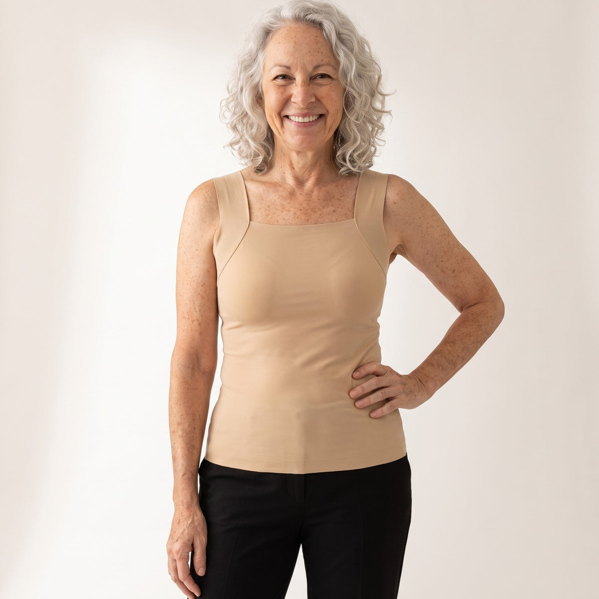 Woman in her late sixties wearing the NIORA Everyday Bra Tank in beige